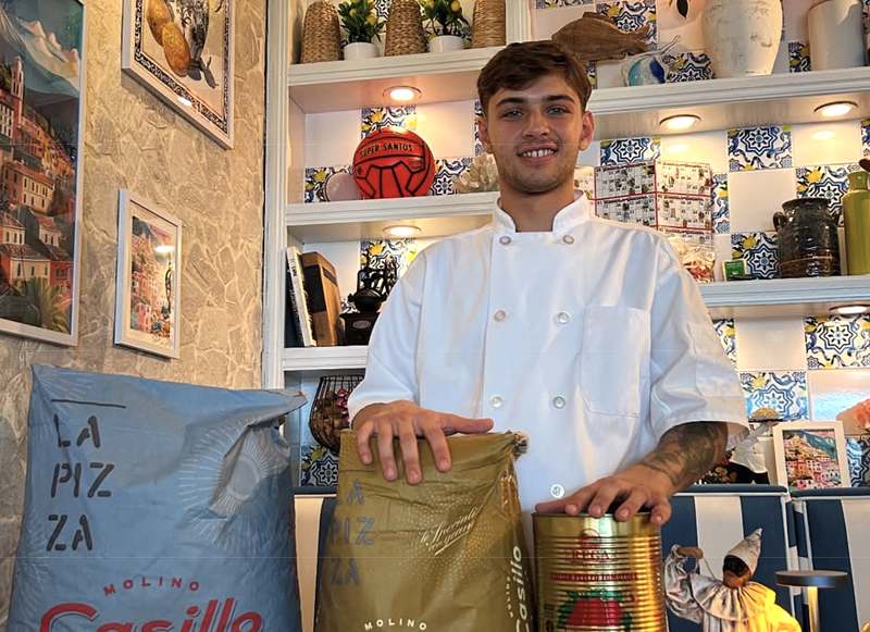 Image: A man and pizza