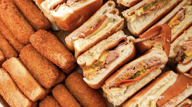 a variety of fried pastries and sandwiches